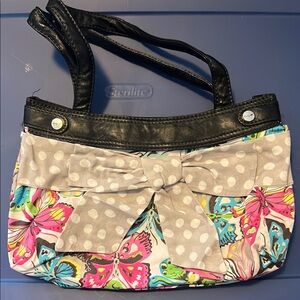 Medium sized thirty-one purse with changeable outside cover.